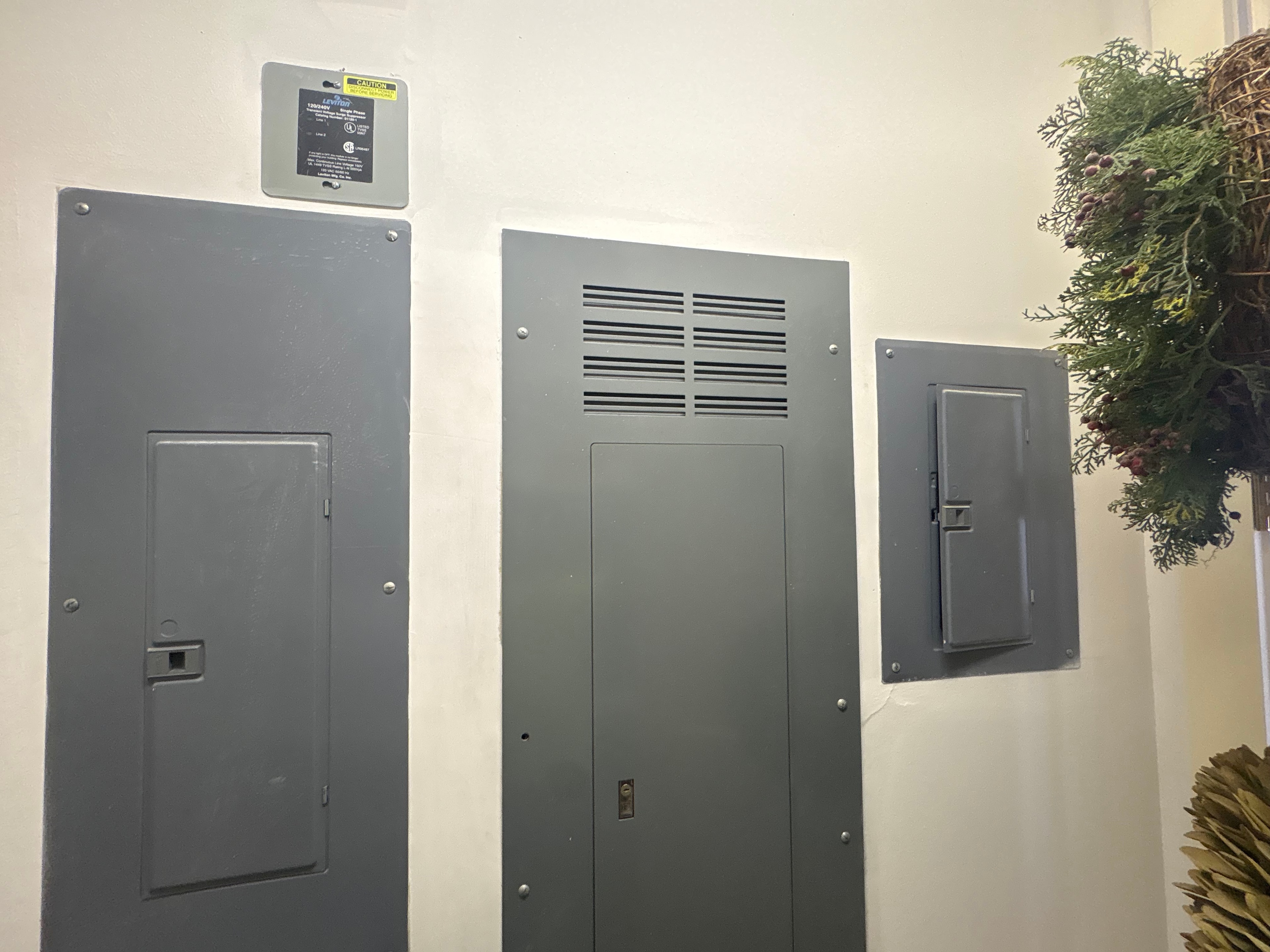 Three electrical panels installed on wall — commercial panel work